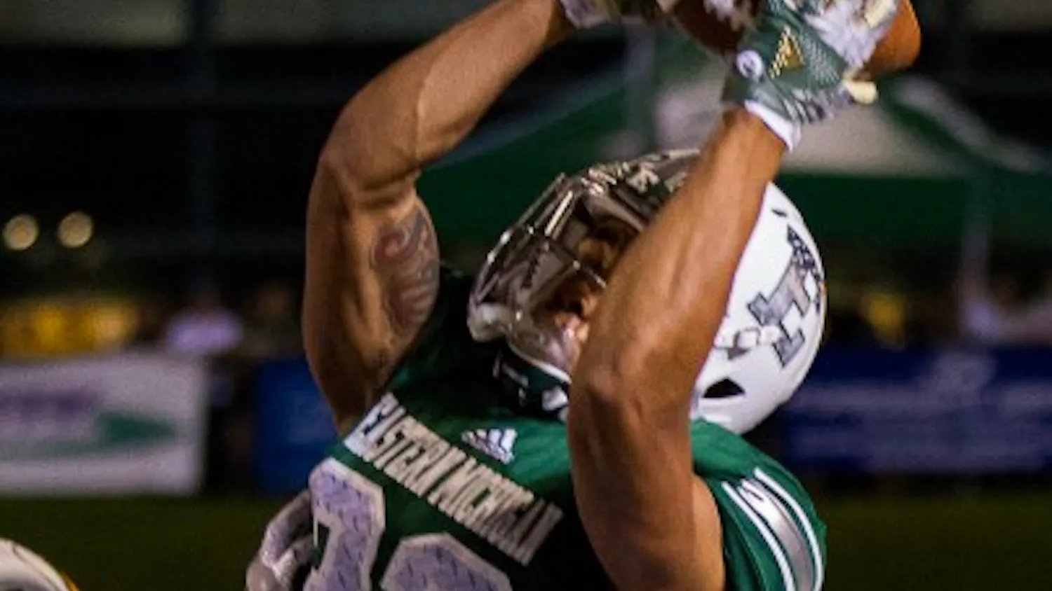 Eastern Michigan receiver Sergio Bailey II jumps high for the catch during the Eagles' 27-24 win over Wyoming in Ypsilanti, 23 Sept.