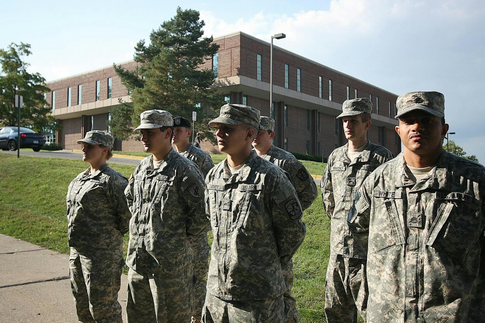 Members of the EMU ROTC stand in formation outside of the ROTC tower.   