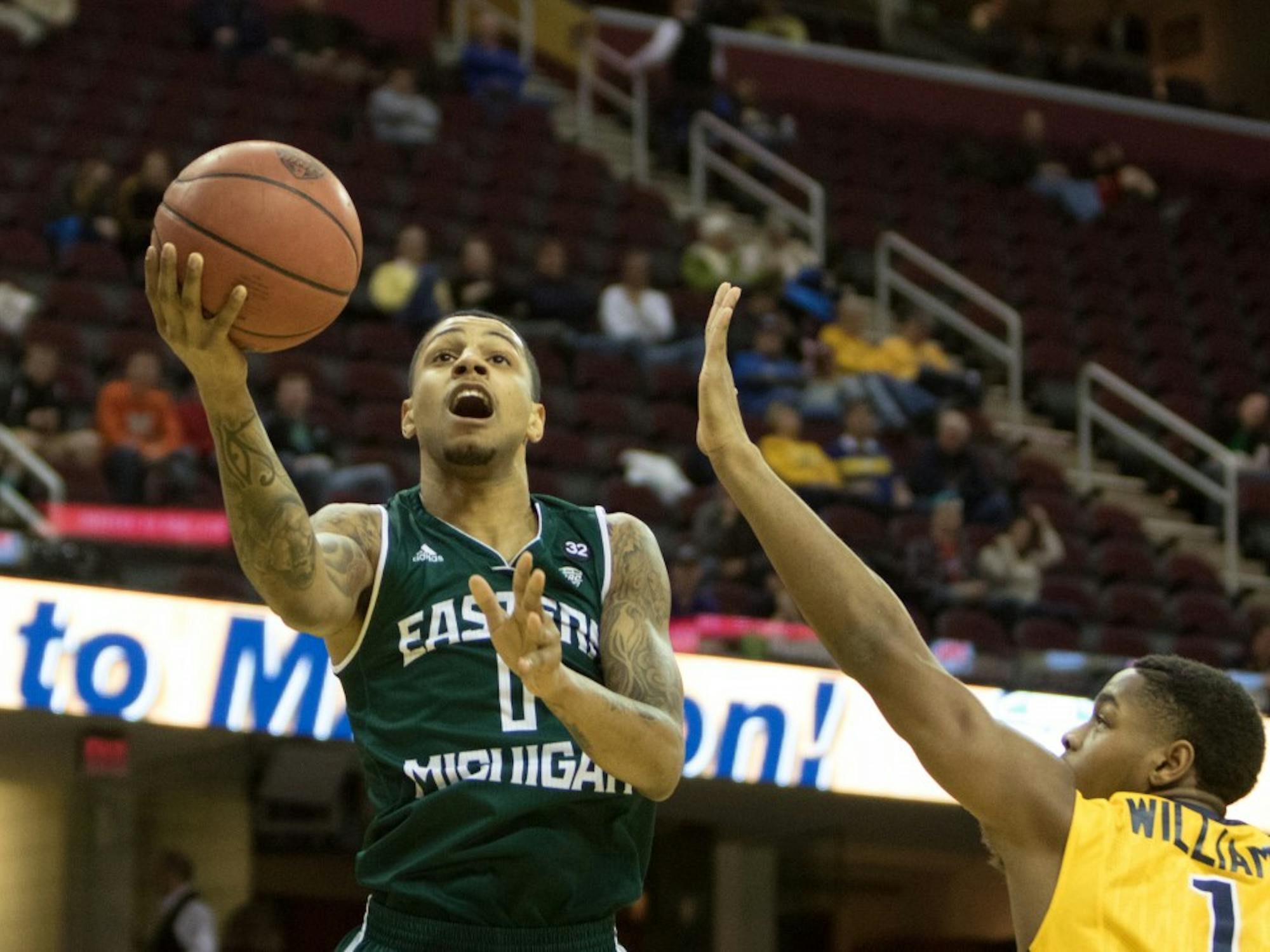 Eastern Michigan guard Ray Lee drives to the basket in the Eagles 78-67 loss to Toledo in the third round of the MAC Tournament in Cleveland, OH on March 12, 2015.