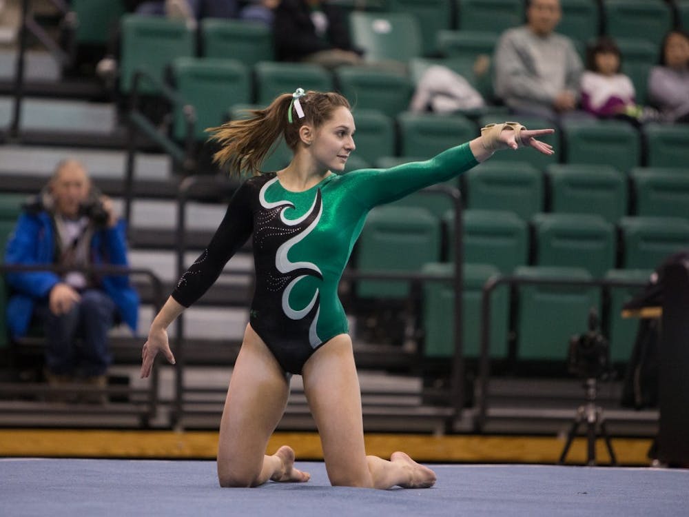 Eastern Michigan sophomore Sydney McEachern competes on the floor in the Eagles 193.925-187.200 victory over Temple University Friday night in Ypsilanti.