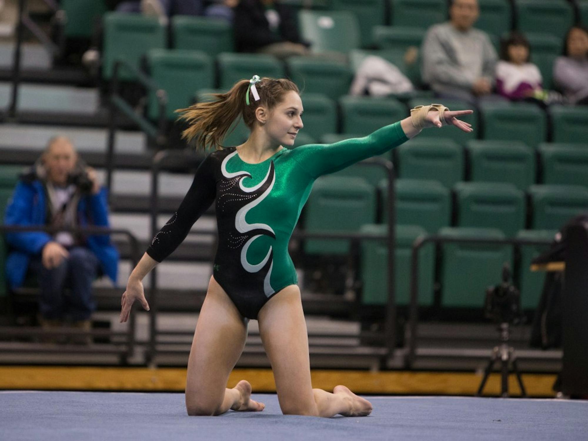 Eastern Michigan sophomore Sydney McEachern competes on the floor in the Eagles 193.925-187.200 victory over Temple University Friday night in Ypsilanti.
