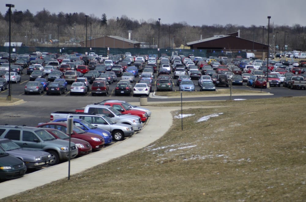 	Many EMU students who commute to campus are irritated with the lack of close spots and the potholes in some lots.