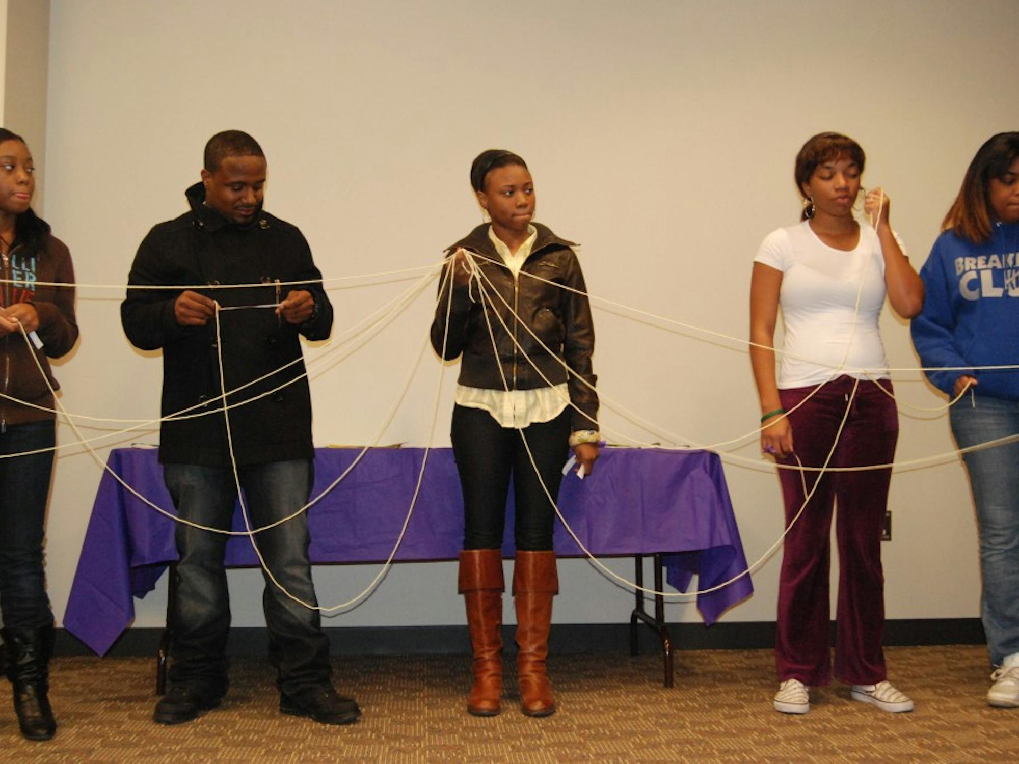 Participants in the “No Strings Attached” activity play the roles of survivor, friend, or relative to show how a survivor might feel when she or he seeks help from those she or he depends upon and is turned down. The lecture, held by the Women’s Center, focused on the fact men as well as women can be victims of domestic violence.