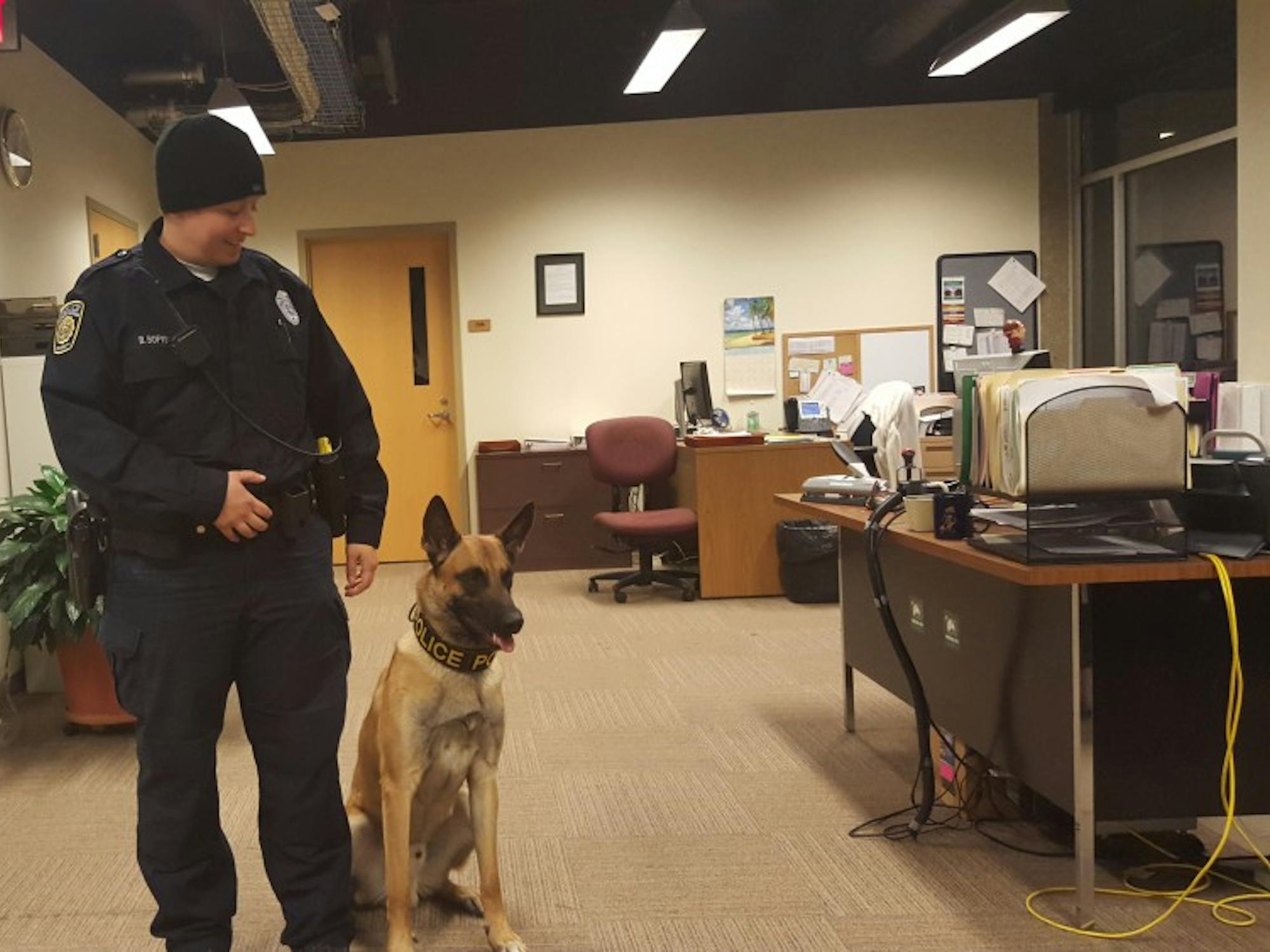 DPS's newest addition, Nitro the dog, with his partner, officer&nbsp;Bridget Bofysil.