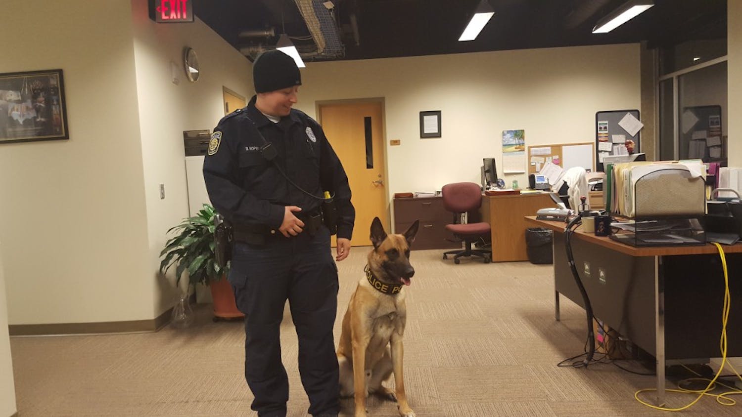 DPS's newest addition, Nitro the dog, with his partner, officer Bridget Bofysil.