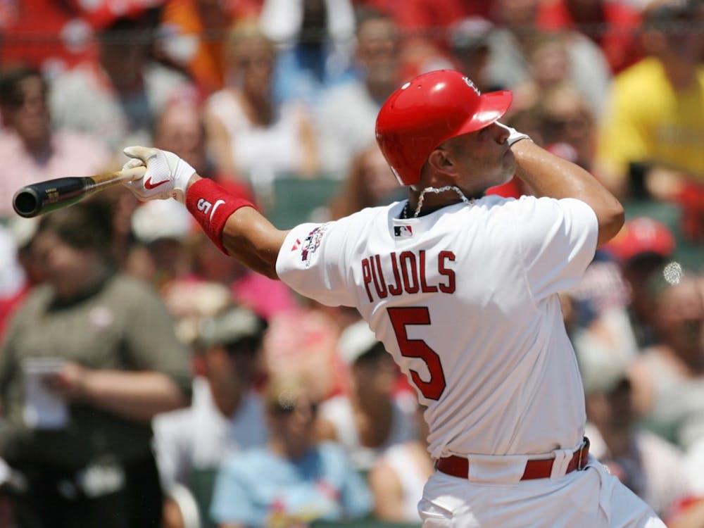 MVP-winning Cardinal Albert Pujols hits a two-run home run in the against the Minnesota Twins at Busch Stadium in St. Louis, Missouri. Pujols adds 30 some home runs each year to his team.Rya 