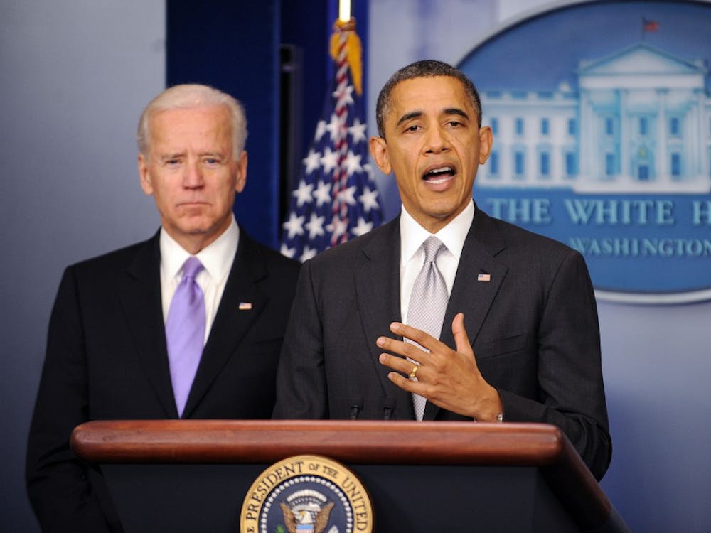 President Barack Obama delivers a statement as Vice President Joe Biden, left, looks on in the Brady Press Briefing Room about the policy process the Administration will pursue in the wake of the Newtown tragedy, Wednesday, December 19, 2012, at the White House in Washington, D.C. (Olivier Douliery/Abaca Press/MCT)