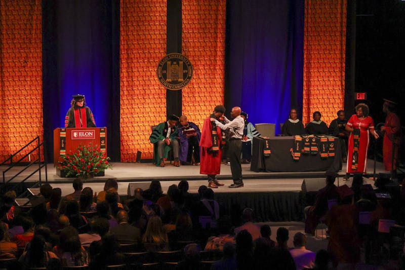 Donning of the Kente: More than a graduation tradition, a 'symbol of  achievement', Inside UNC Charlotte