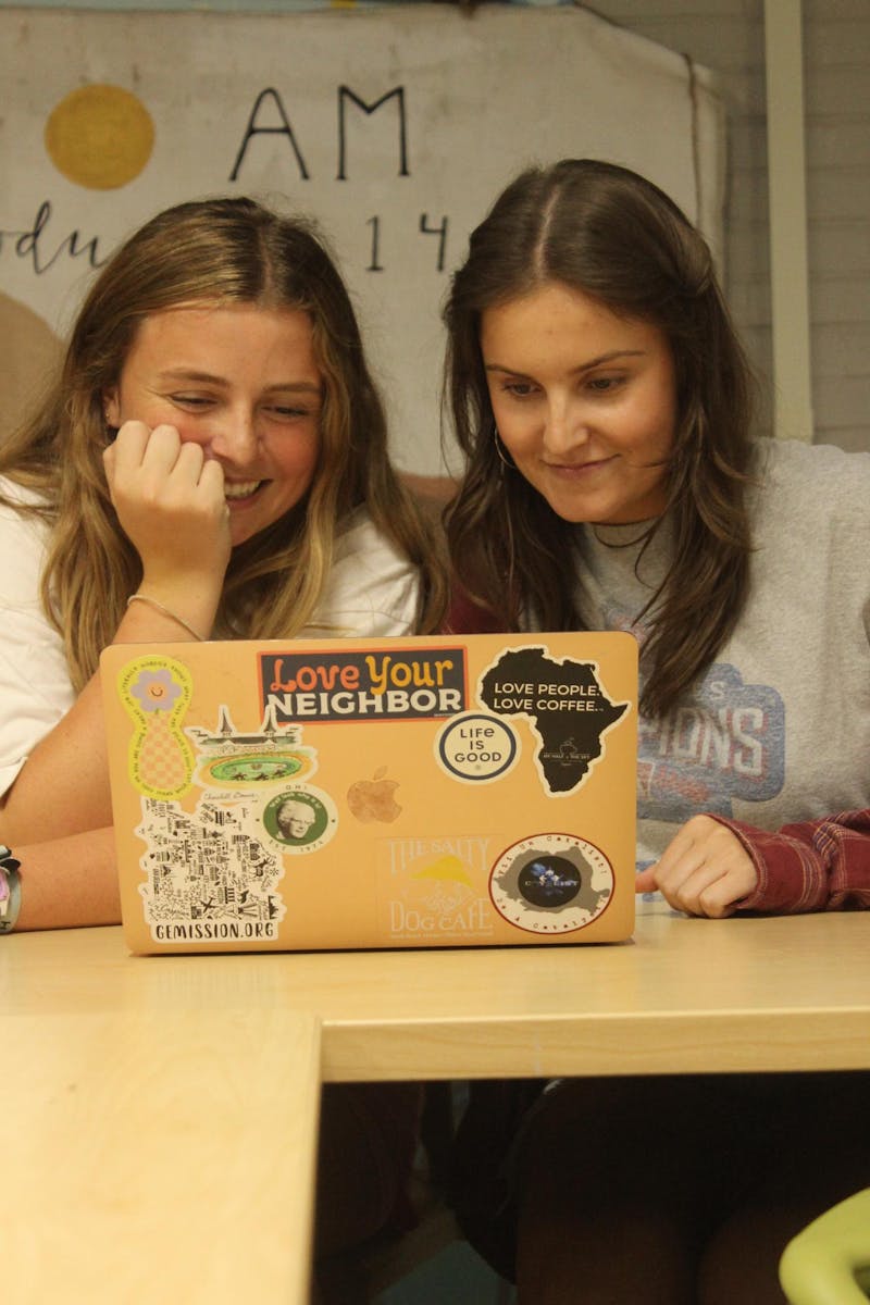 Sophomore Lily Gerry and senior Olivia Otto express their unique aesthetics through laptop art.