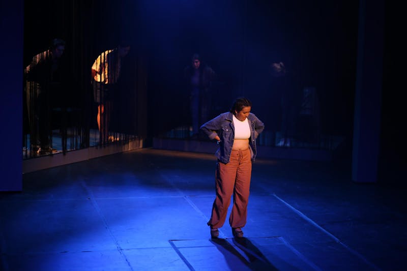 Karis Bland during a practice of “Everybody” with the ensemble in the background.
