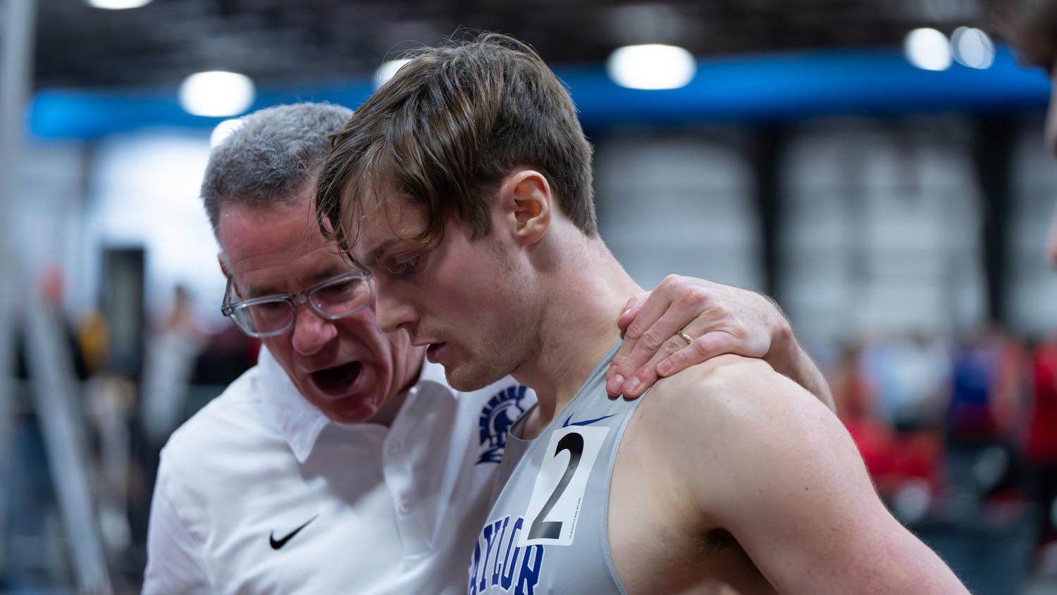 Coach Q and men's runner.jpg