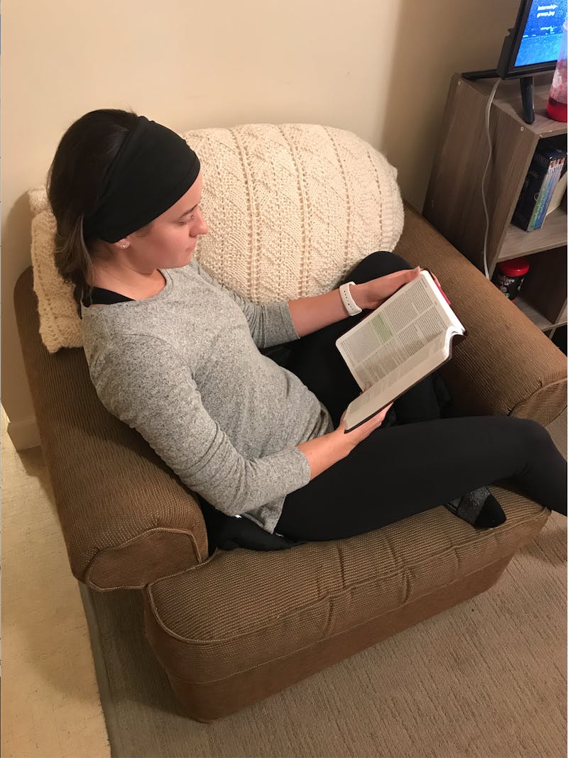 Senior Julia Clark reading her Bible