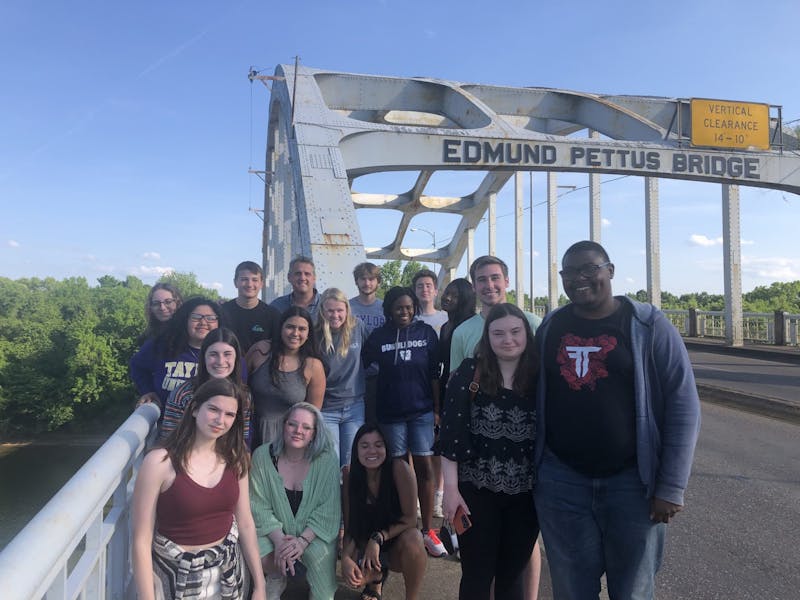 Scott Moeschberger and students at the Edmund Pettus Bridge in Birmingham, Alabama.