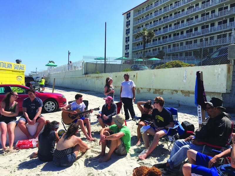 The Daytona team hangs on the beach with locals. (Photograph provided by Daytona SBM Team)