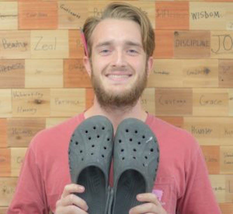Drew Shriner poses with his Crocs.