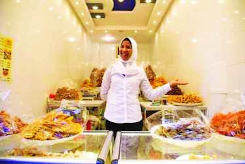 A Moroccan sweet shop worker, Amira welcomes all visitors with a honey-covered pastry. (Photograph provided by Abigail Roberts)