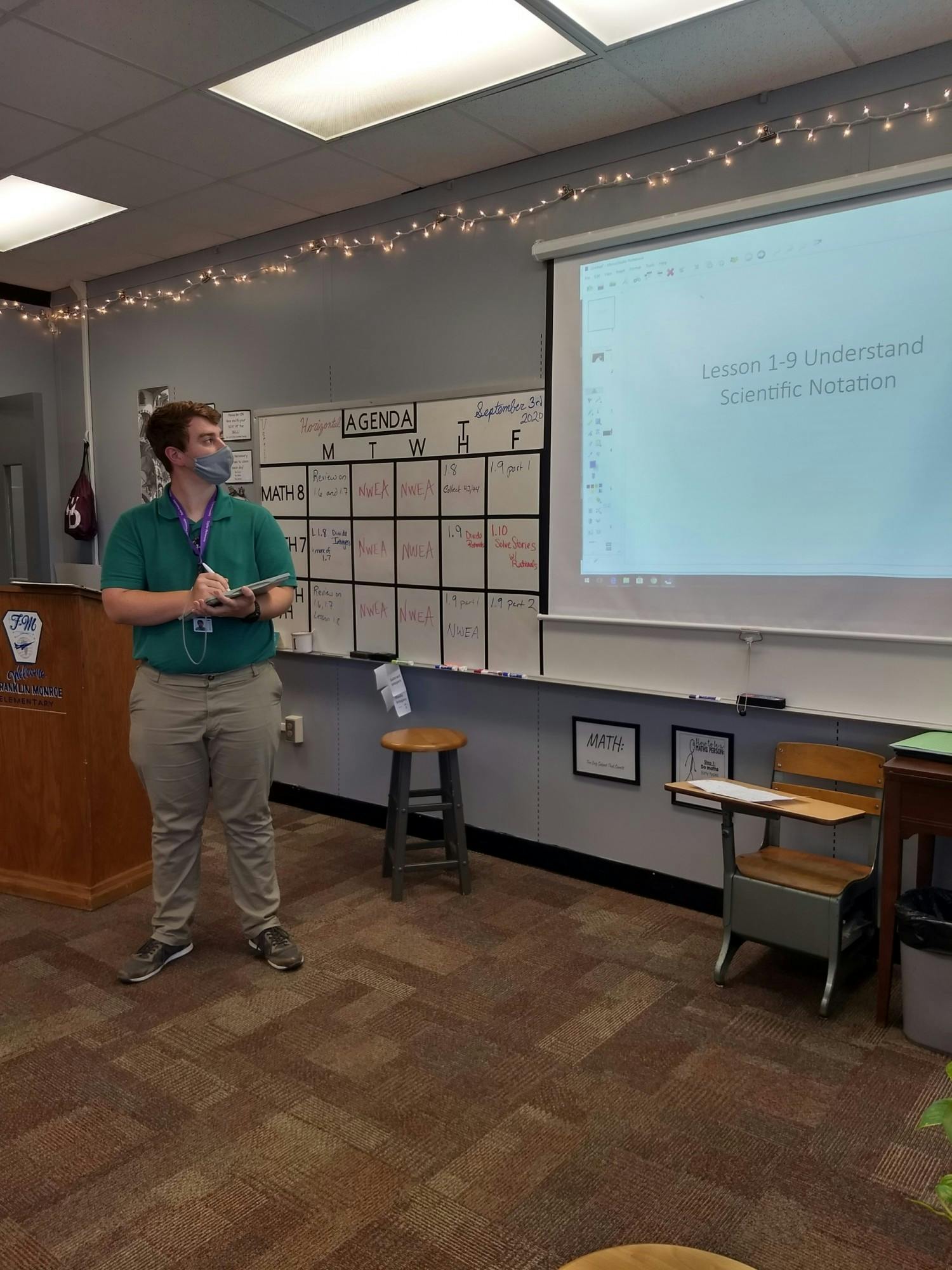 Senior Logan Tuckey engages with his math class while wearing a mask and being socially distanced. 