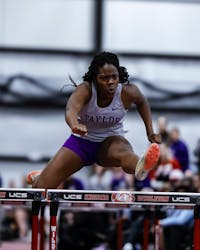 Patience Sakeuh qualified for Nationals in the 60-meter hurdles at the Trojan Invite.