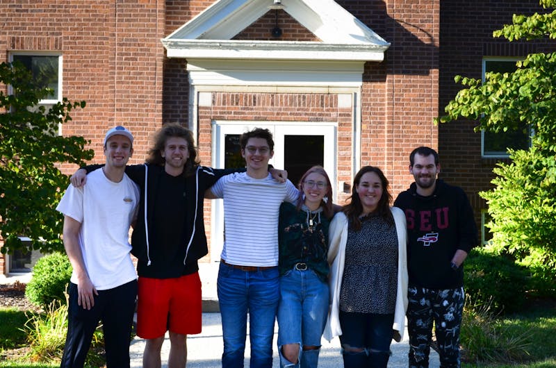 Swallow residents Martin Didier, Dain Wyngarden, Russell Knapp, Haley Keppel, Kaelynn Schultz and Ethan Jackson pose in front of Swallow Robin Hall.