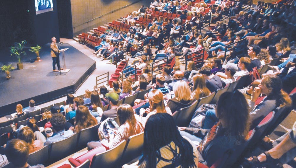 Dr. Michael Hammond looks out upon the larger-than-expected crowd in Mitchell Theatre.