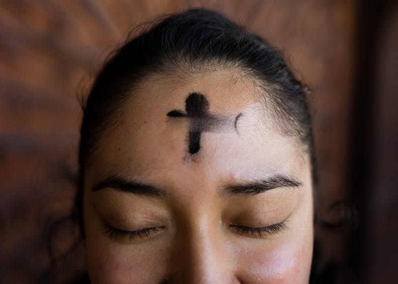 Ashes applied to the forehead during an Ash Wednesday service is a typical Lenten practice.
