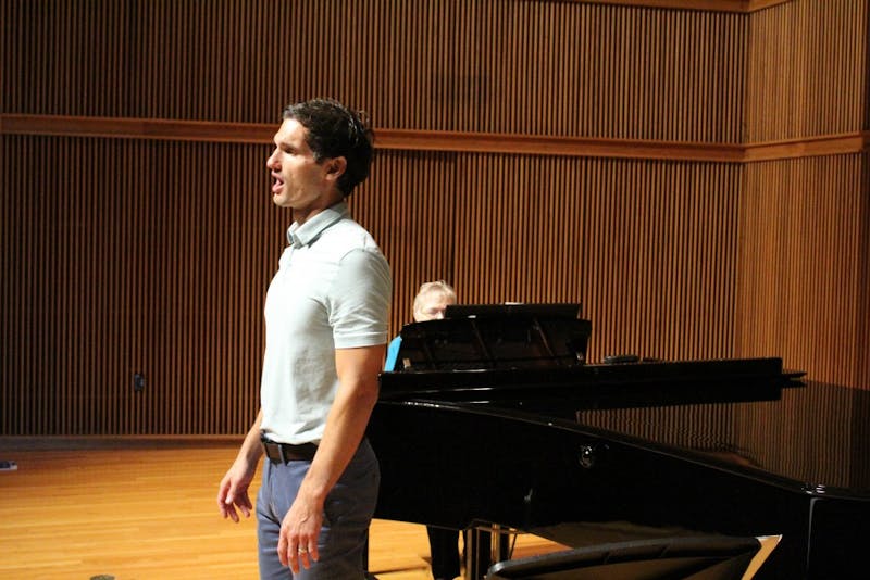 Conor Angell rehearses for his solo performance of “Winterreise”
