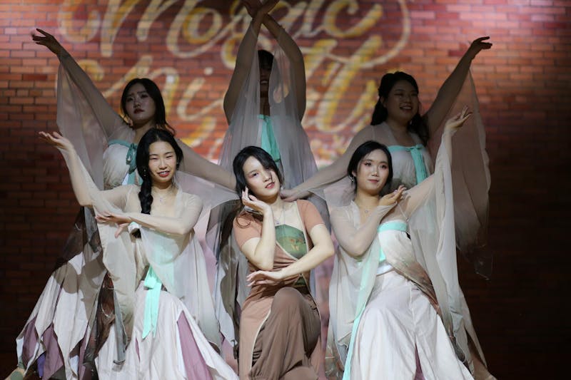 The Chinese female students pose after performing a traditional dance.