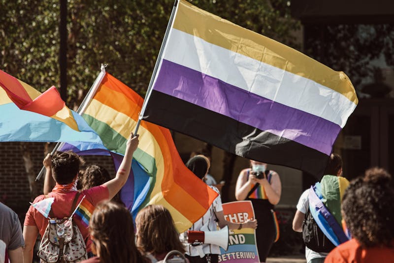 IWU students march with flags held high in support for Zebulun Knuteson