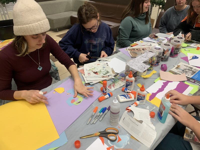 Students participated in art therapy through various artistic activities at an event.