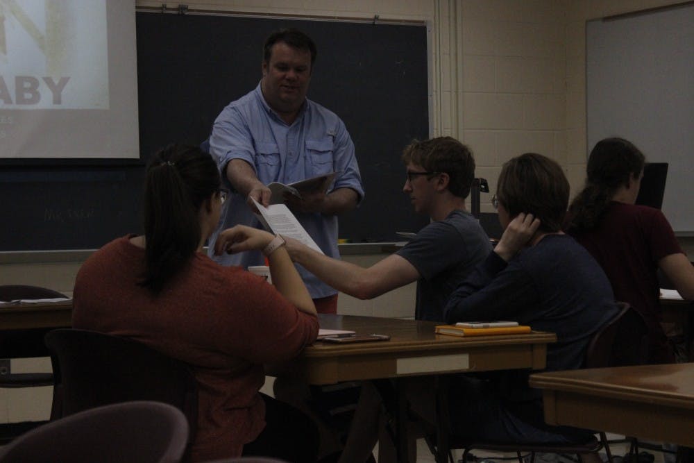 Cecil Stokes, an accomplished screenwriter, teaches upperclassmen about character development during a professional writing class.