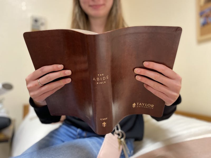Carolynne Winkle thumbs through her new Abide Bible.