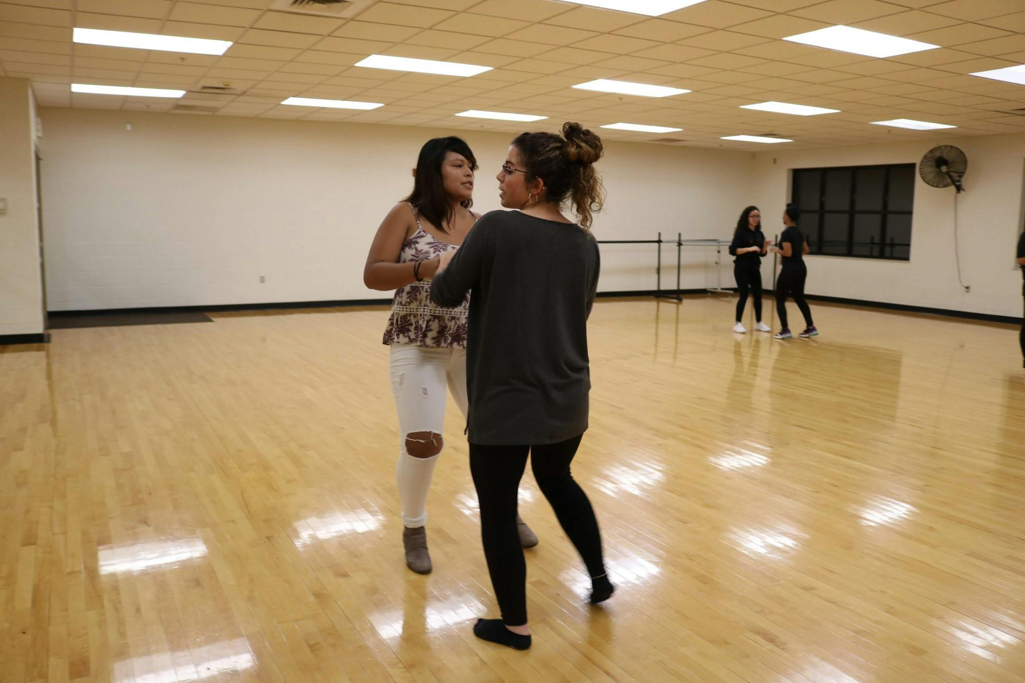 Alejandra Reyes and Lily Eschweiler teach merengue.