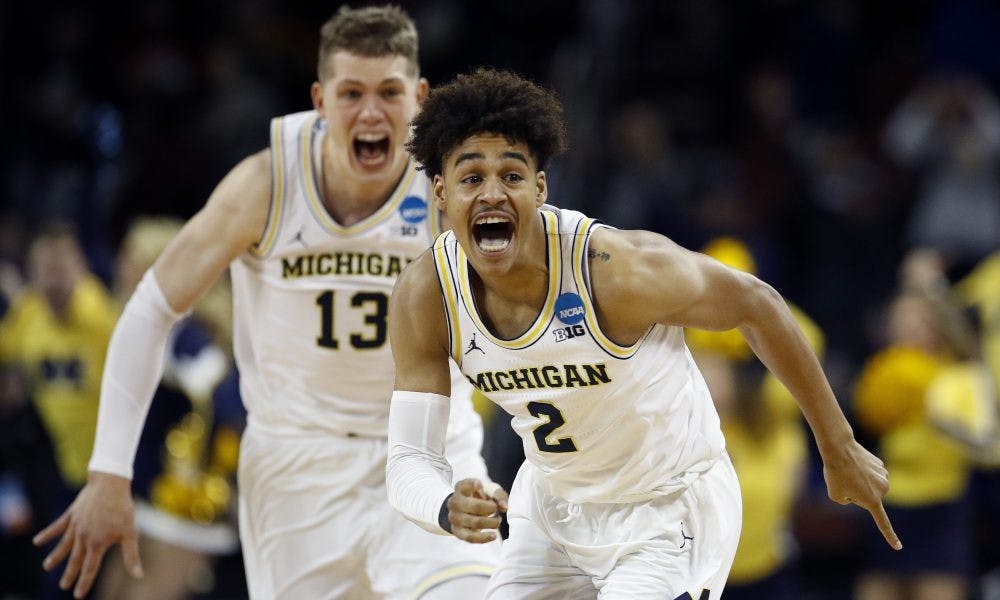 ap_ncaa_houston_michigan_basketball_98521354-e1521348608468