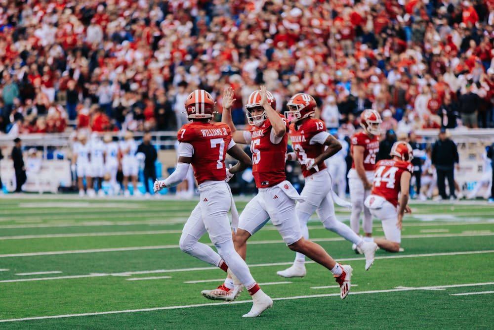 Fernando Mendoza (center) celebrates with E.J. Williams during Indiana's win over UCLA on Oct. 26, 2025. (HN photo/Jake Weinberg)