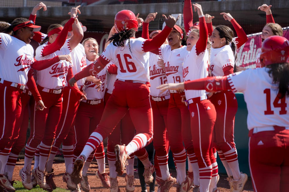 Brianna Copeland celebrates with her teammates after hitting a home run during Indiana’s win over Wisconsin-Green Bay in the Hoosier Classic. (HN photo/Nicholas McCarry)