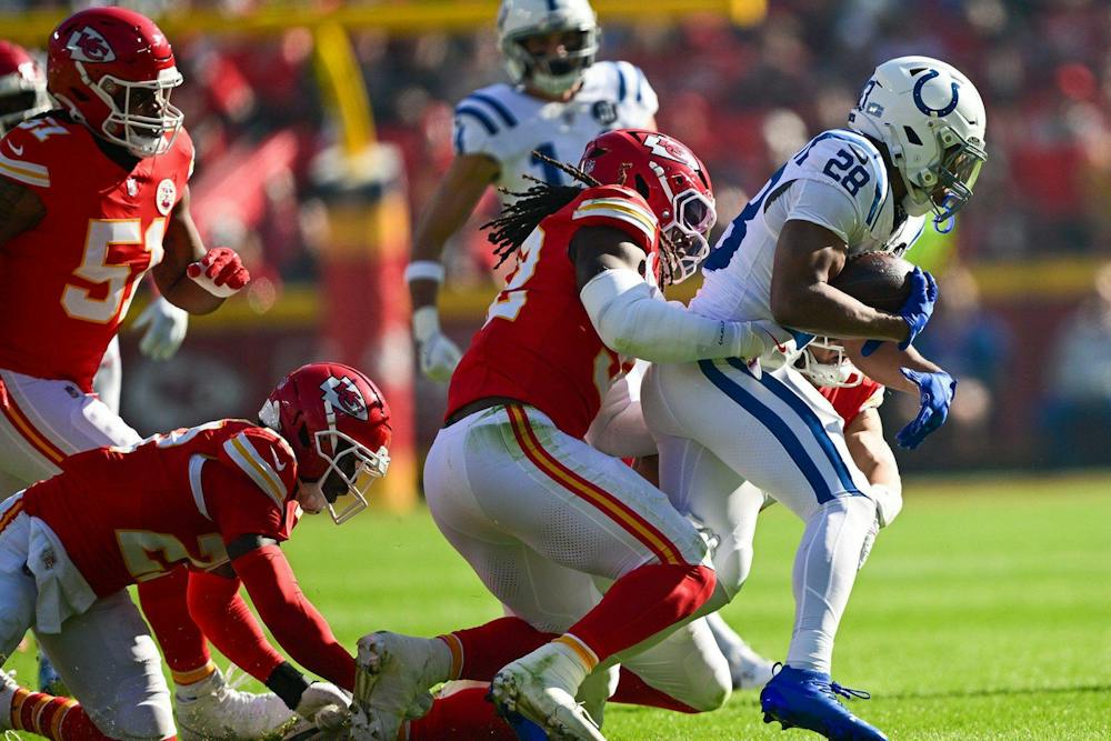 Chiefs linebacker Nick Bolton tackles Indianapolis Colts running back Jonathan Taylor (No. 28) during an NFL Week 12 game on Sunday, Nov. 23, 2025, at GEHA Field at Arrowhead Stadium in Kansas City. (Tammy Ljungblad, The Kansas City Star, TNS)