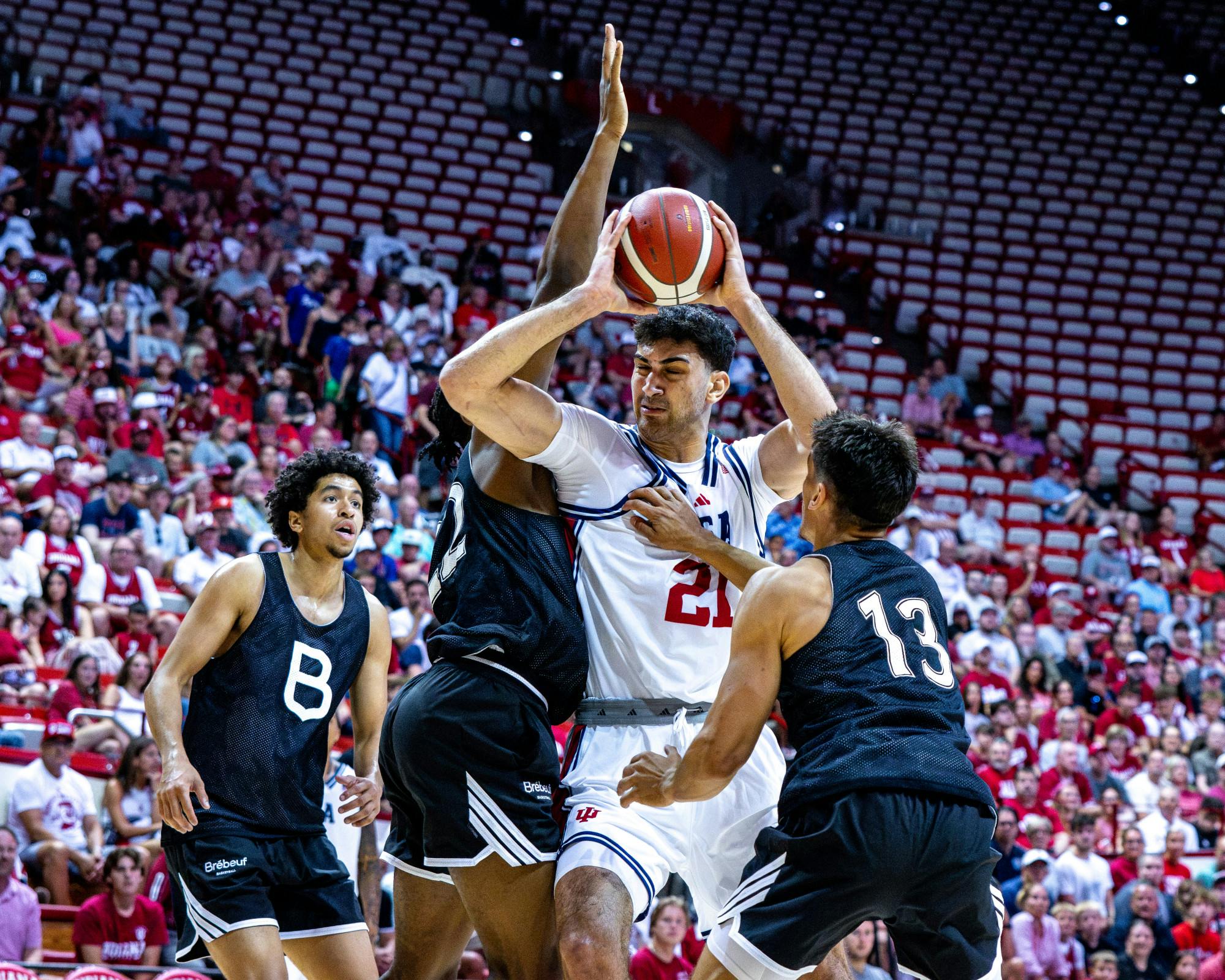 Samet Yigitoglu drives through contact during Indiana's exhibition win over Collège Jean-de-Brébeuf (Team Canada) on July 15, 2026 as Simon Skjodt Assembly Hall. (HN photo/Lauren McKinney)