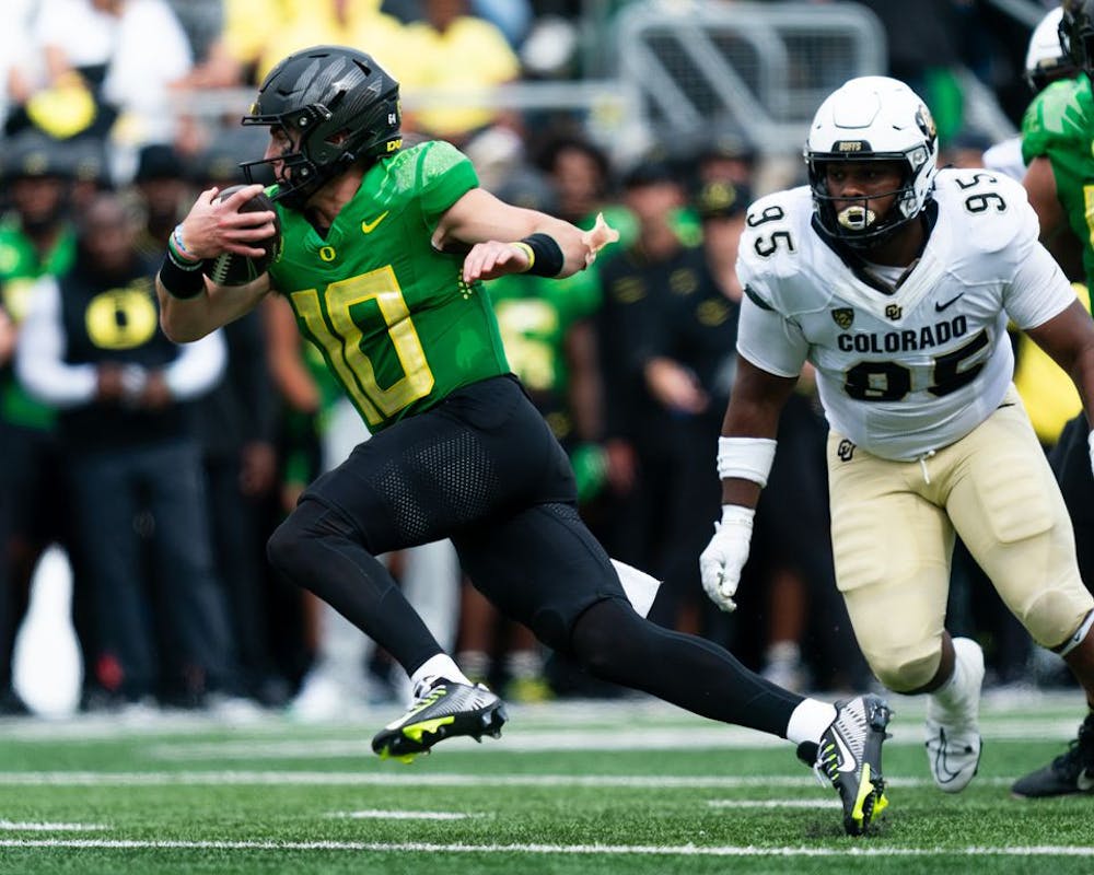 Quarterback Bo Nix (10) of the Oregon Ducks runs the ball in for a touchdown at the end of the first half of the game against the Colorado Buffaloes on Saturday, Sept. 23, 2023, at Autzen Stadium in Eugene. (Ali Gradischer/Tribune Content Agency)