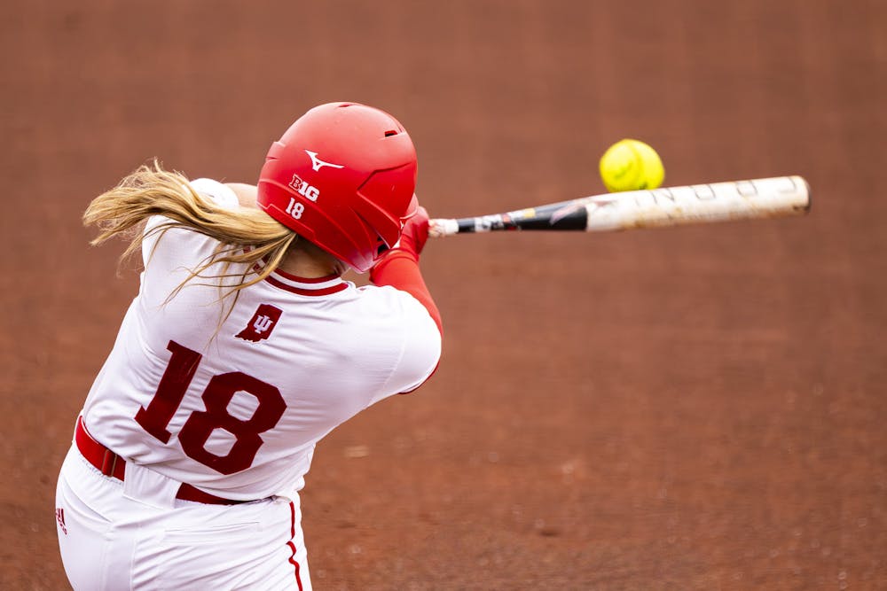 Indiana catcher Avery Parker drives a ball at home against Loyola on March 10, 2026. (Photo by Brady Owen / The Hoosier Network)