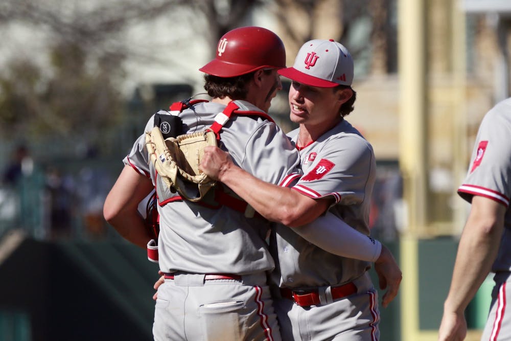 Ty Bothwell and Brock Tibbitts celebrate after Indiana’s win over Dallas Baptist on Saturday, March 2. (Photo via Indiana Athletics)