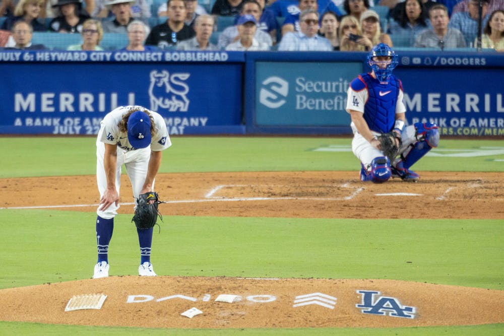 Los Angeles Dodgers pitcher Tyler Glasnow, left, looks to the ground in frustration and catcher Will Smith watches the ball soar as the Milwaukee Brewers' Rhys Hoskins, not pictured, rounds the bases after hitting a grand slam in the fourth inning at Dodger Stadium on July 5, 2024, in Los Angeles. (Allen J. Schaben/Los Angeles Times/TNS)