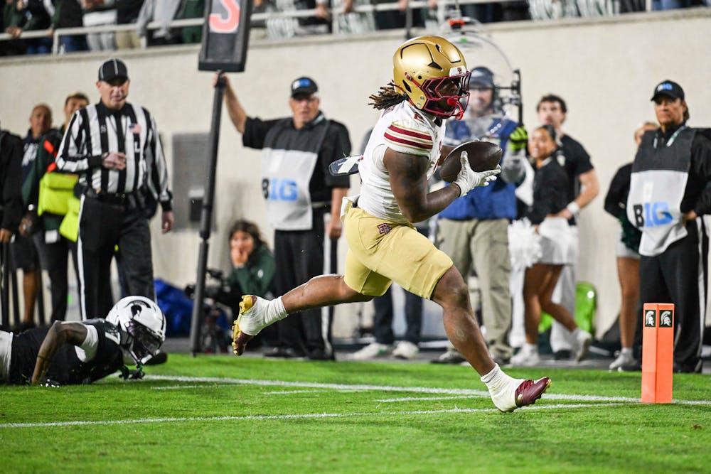Boston College's Turbo Richard carries the ball into the end zone after Michigan State's Joshua Eaton fails to tackle him during the first half of a game in 2025. (Katy Kildee, The Detroit News/Tribune Content Agency)