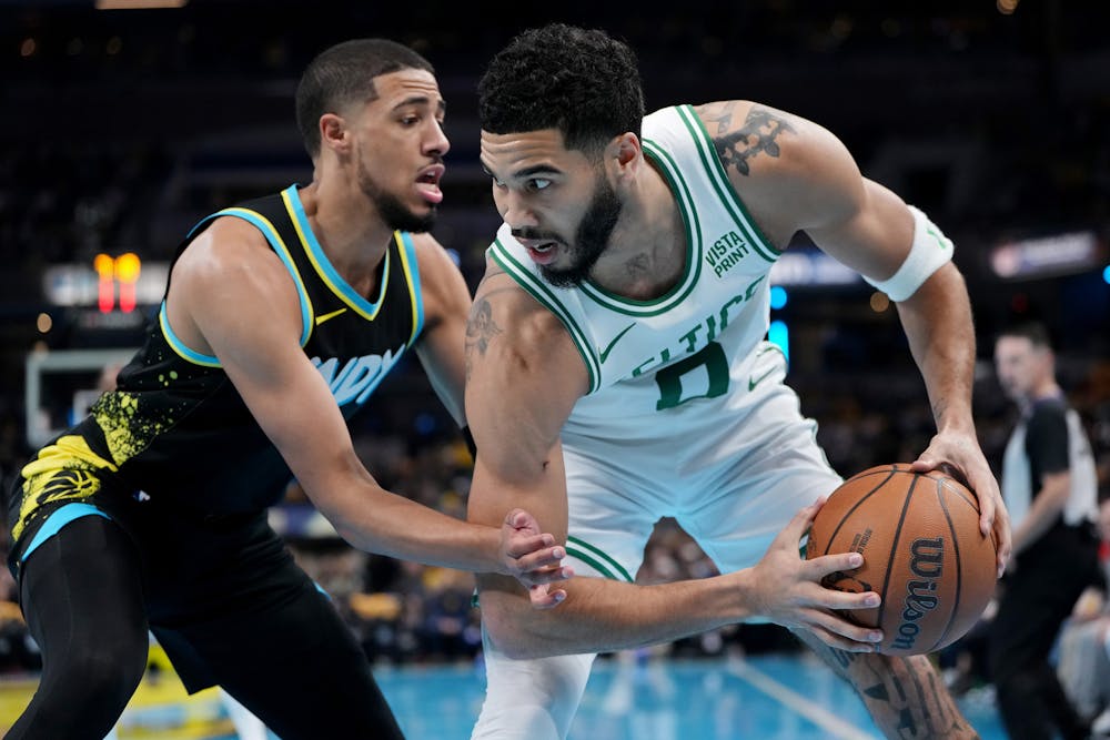 Jayson Tatum (0) of the Boston Celtics handles the ball while being guarded by Tyrese Haliburton (0) of the Indiana Pacers in the first quarter during the NBA In-Season Tournament at Gainbridge Fieldhouse on Monday, Dec. 4, 2023, in Indianapolis. (Dylan Buell/Getty Images/TNS)