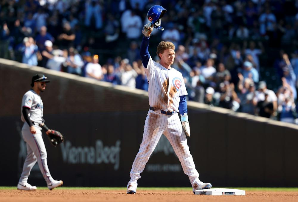 Cubs center fielder Pete Crow-Armstrong acknowledges applause after stealing second base in the first inning against the Marlins at Wrigley Field on Sept. 24, 2026. With the steal, he became the seventh player in MLB history to reach 40 home runs and 40 stolen bases in a season. (Chris Sweda/Chicago Tribune)