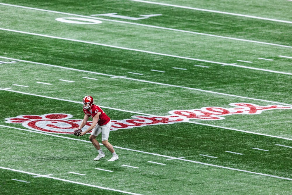 <p>Indiana punter Mitch McCarthy punts during the College Football Playoff Semifinal at the Chick-fil-A Peach Bowl versus No. 5 Oregon on Jan. 9 in Atlanta. (HN photo/Kal Graybill)</p>