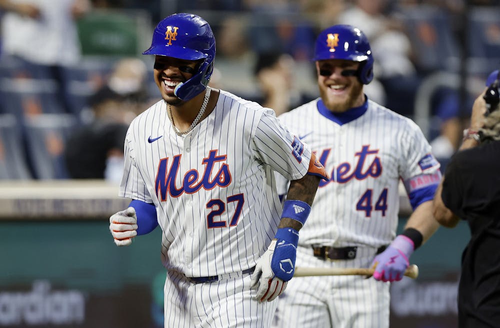 The New York Mets' Mark Vientos (27) celebrates his fourth-inning home run against the New York Yankees with teammate Harrison Bader (44) at Citi Field on Tuesday, June 25, 2024, in New York. (Jim McIsaac/Getty Images/TNS)