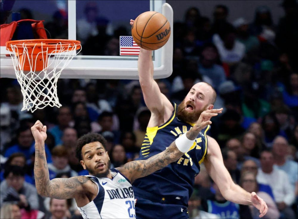Indiana Pacers center Jay Huff (32) and Dallas Mavericks forward P.J. Washington (25) leap for a first half rebound at the American Airlines Center in Dallas, October 29, 2025. (Tom Fox/Tribune Content Agency)