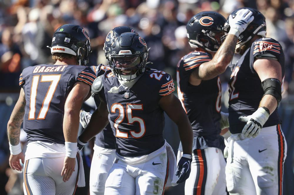 Bears running back Kyle Monangai (25) celebrates his touchdown with quarterback Tyson Bagent (17) in the first quarter against the Jets on Sunday, Oct. 4, 2026, at Soldier Field. (Brian Cassella/Chicago Tribune/TNS)