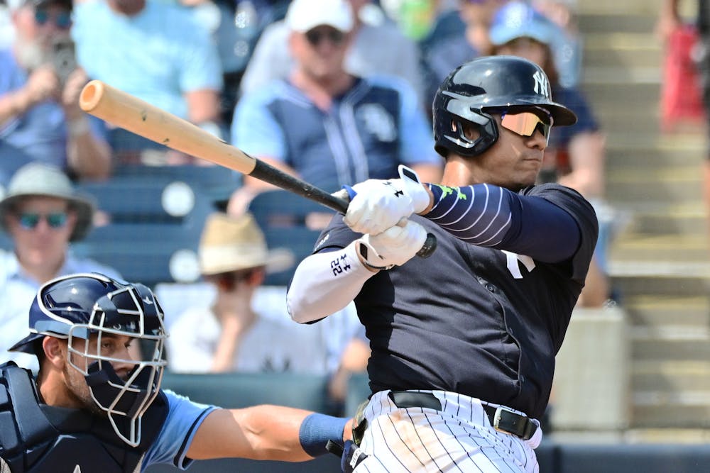 The New York Yankees' Juan Soto hits a single in the first inning against the Tampa Bay Rays during a spring training game at George M. Steinbrenner Field on March 6, 2024, in Tampa, Florida. (Julio Aguilar/Getty Images/TNS)