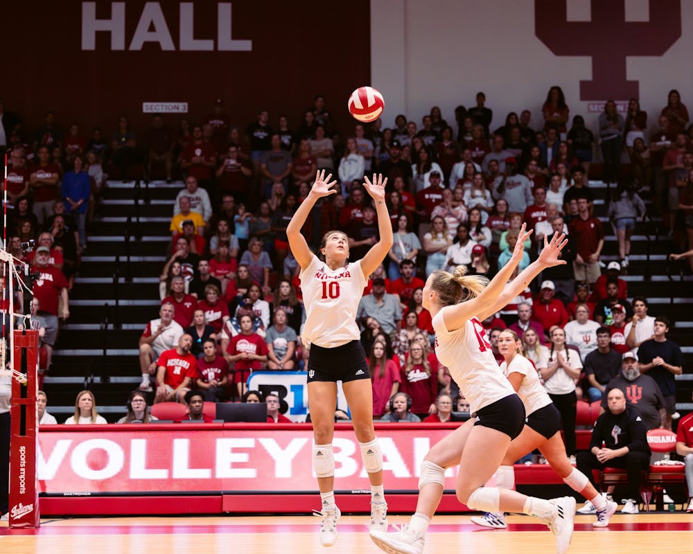 <p>Camryn Haworth sets the ball for Kaley Rammelesberg to win a point late in the first set in Indiana&#x27;s match versus Nebraska on Sept. 30</p>